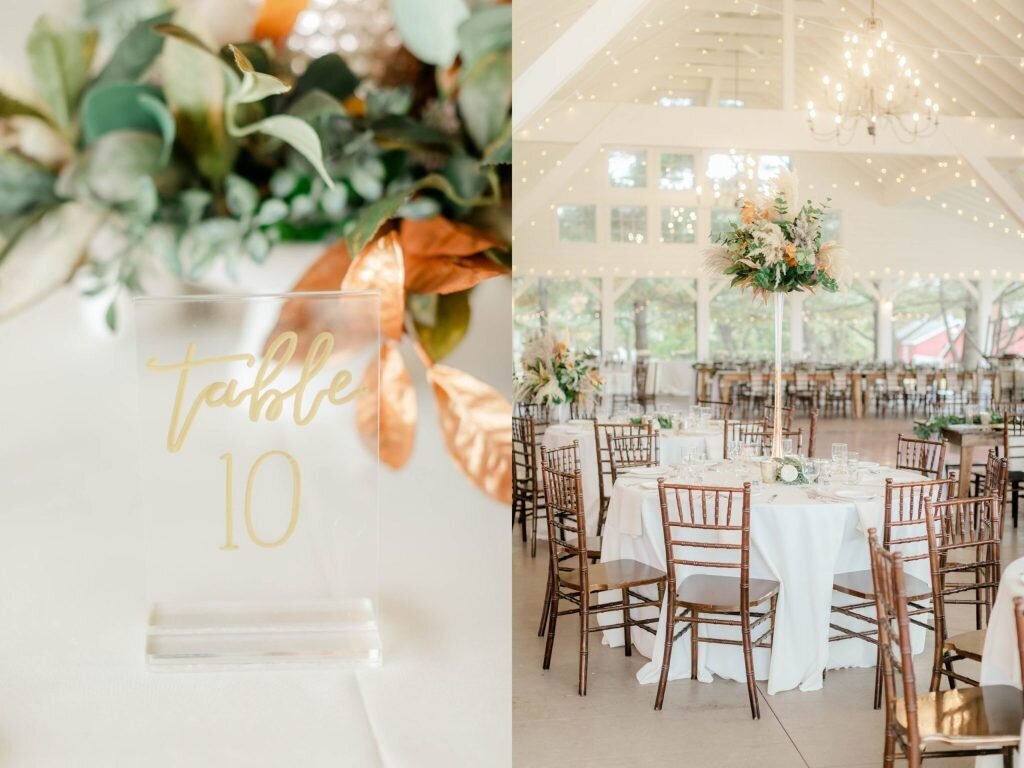Clear acrylic table number and autumn florals at the reception
